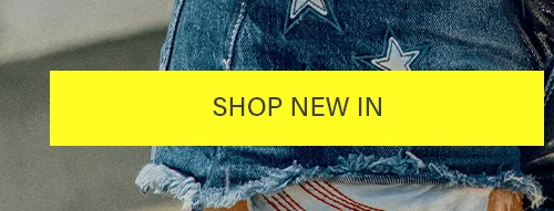 SHOP NEW IN button over trendy star-print denim shorts with frayed hems. Discover latest arrivals!