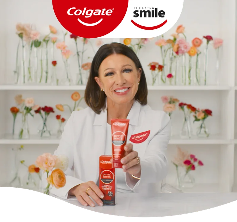 Photo of dental professional holding Optic White Pro Series toothpaste