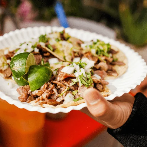 Image Description: Close-up of tacos on a paper plate