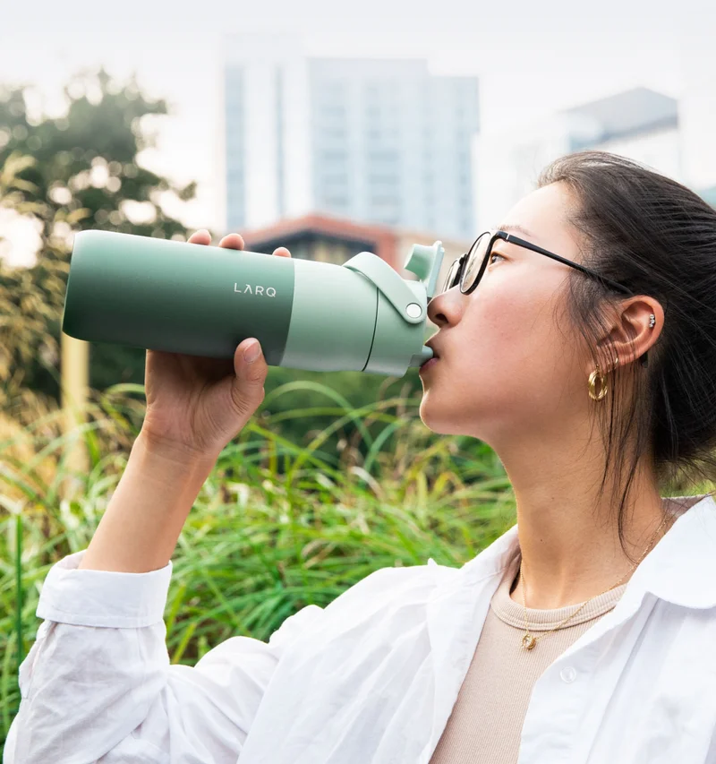 Woman drinking from LARQ Bottle Swig Top
