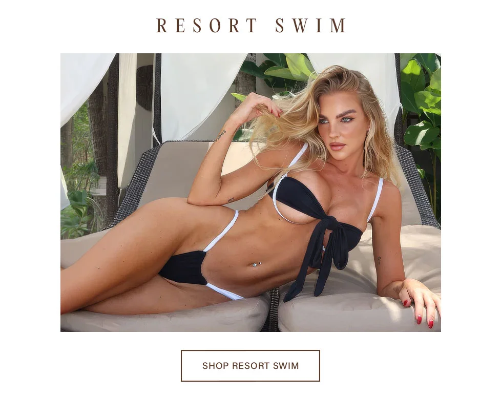 Resort Swim: Blonde model in black tie-front bikini with white straps, lounging. Shop luxury swimwear & resort fashion.