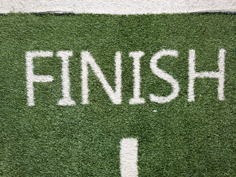 Green grass with the word “Finish” painted in white.