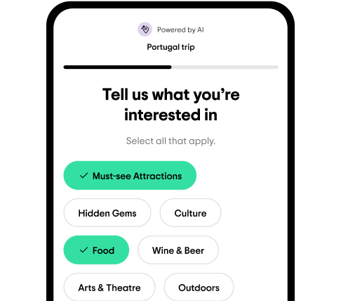 Image Description: A phone screen featuring the Tripadvisor AI Trip Builder—where a traveler has selected interests like “Must-see Attractions” and “Food” while generating a Portugal itinerary
