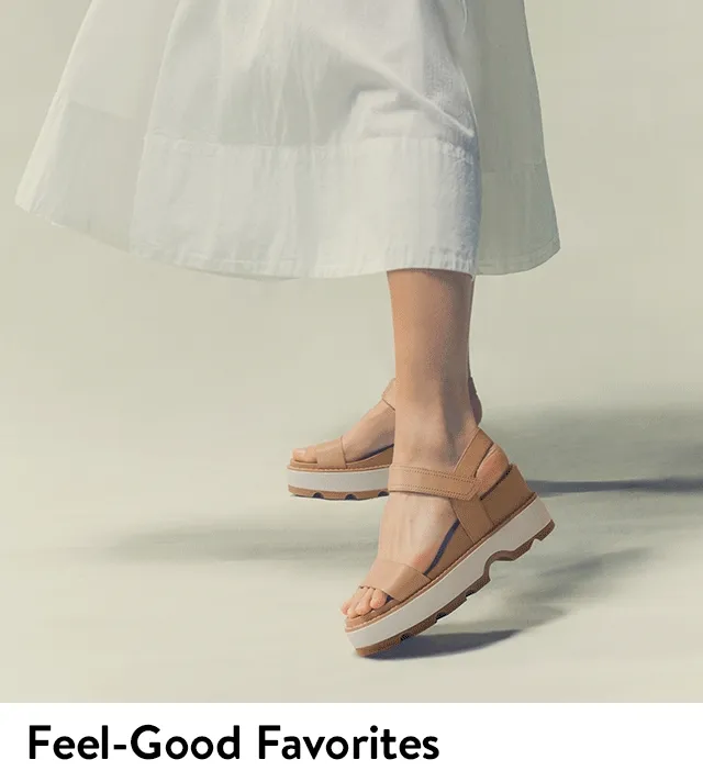 A woman wearing tan platform sandals.