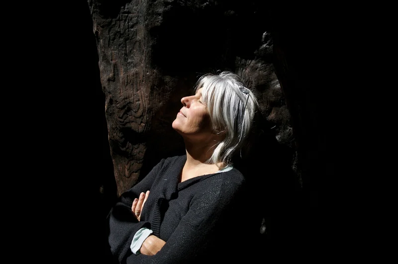 A woman with gray hair enjoys the sun in Marin, California.