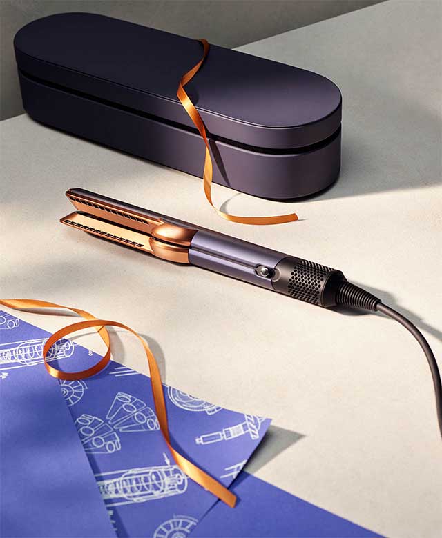 The Dyson Airstrait wet to dry straightener in Prussian blue and Rich copper