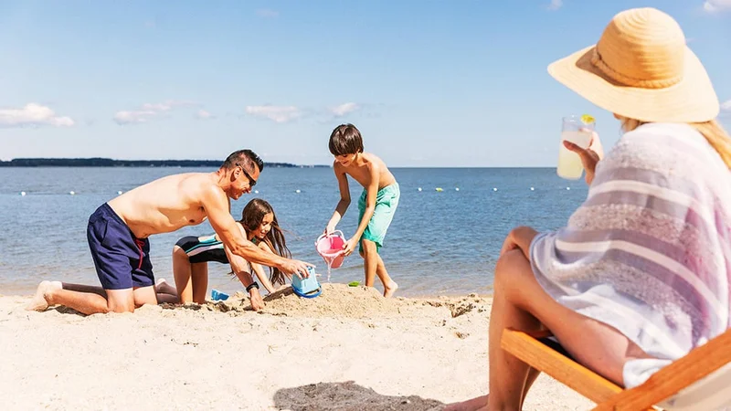 Image description: Family at the beach, in Williamsburg, Virginia.