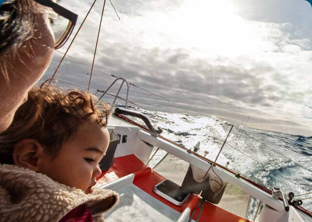 A mother and her child riding on a boat.