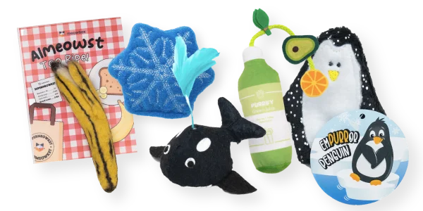 Images of the Almeost Too Ripe Banana toy, Snow is in the Fur-Cast snowflake toy, Orca Whale toy, Purrify Green Juice Kicker, Empurror Penguin toys and more