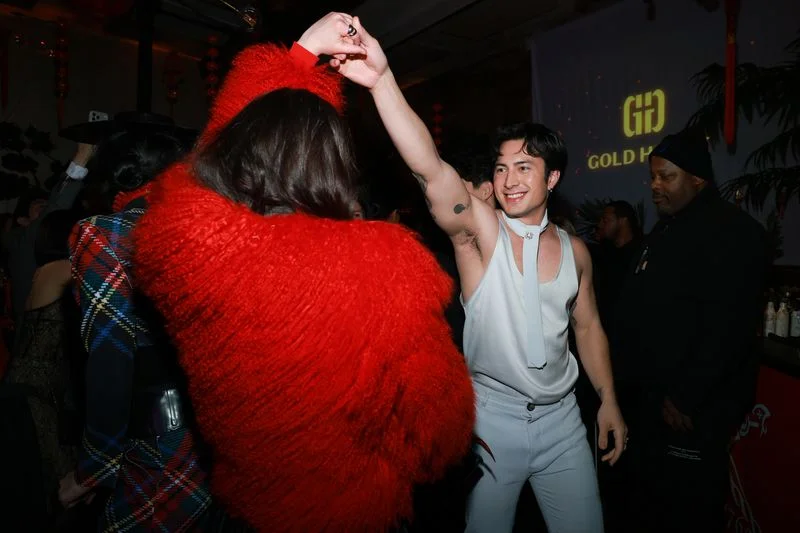 Hudson Williams twirls Lola Tung at Gold House