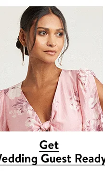 A woman wearing a floral-print dress.