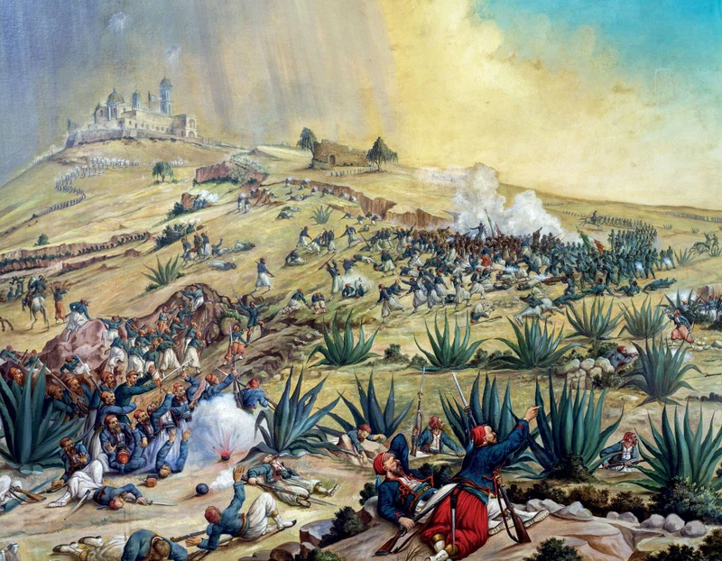 General Zaragoza’s Mexican army repels French forces during the Battle of Puebla on May 5, 1862, depicted in a painting by Patricio Ramos Ortega.