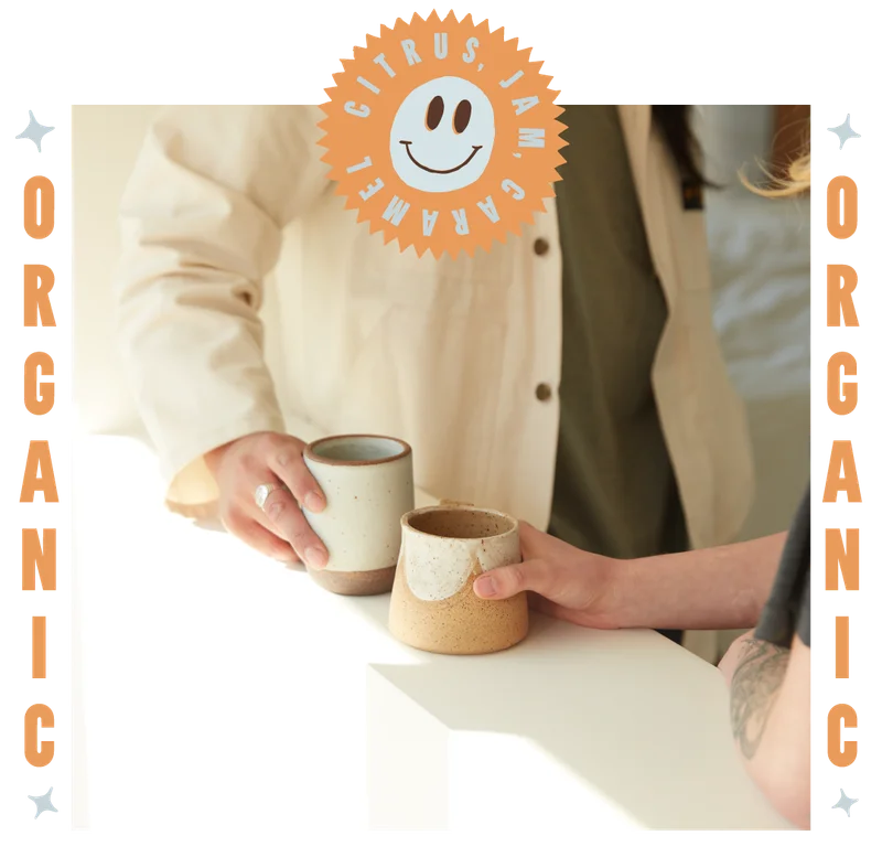 IMAGE: two people drinking coffee.
