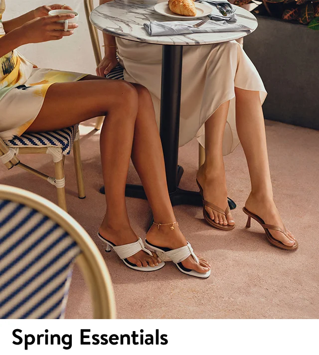 Women wearing heeled thong sandals.