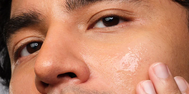 Kyle applying Balancing & Clarifying Serum