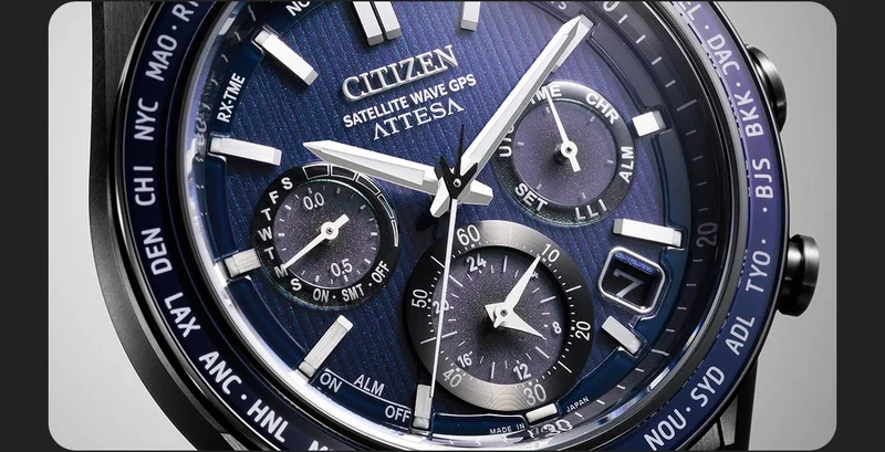 A close-up of the Attesa with a textured blue dial showcasing its three registers and applied silver-tone accents.