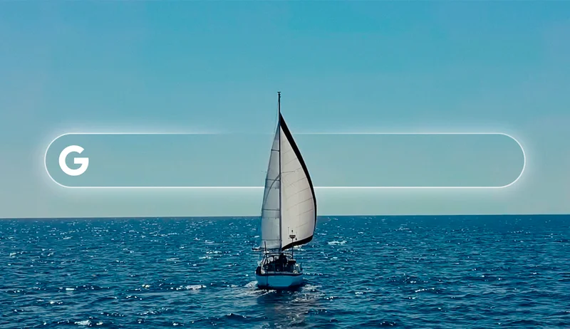A graphic depicting a sailboat on the water with a Google Search bar overlaid on the image
