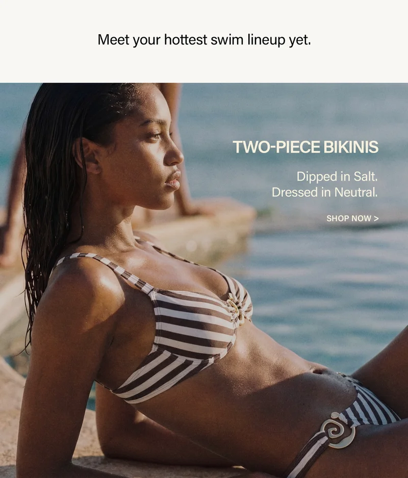 Woman in a chic striped brown and cream two-piece bikini, lounging by the water. Discover our new neutral swimwear collection.
