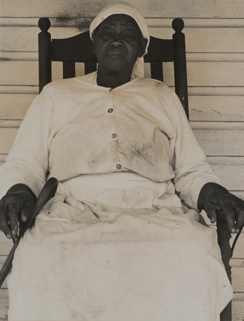 A woman sits in a rocking chair