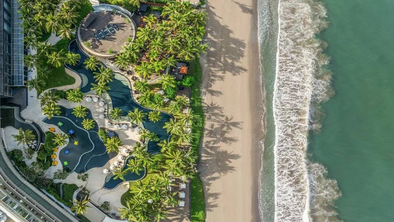 Image description: An aerial view of the beach and resort at W Bali - Seminyak.