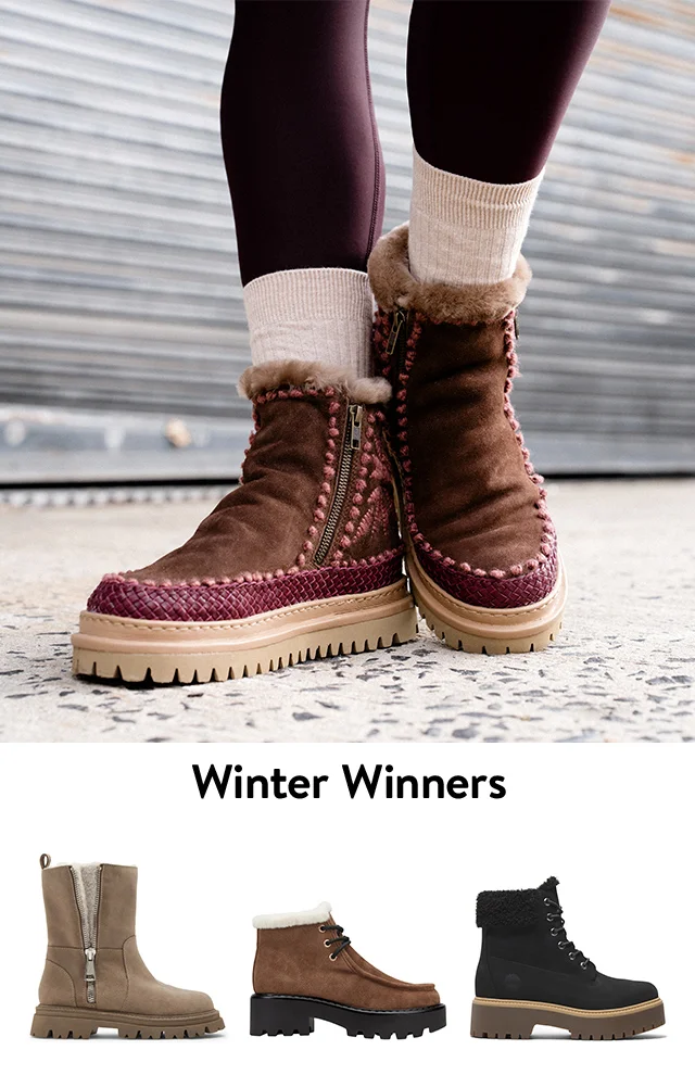A woman wearing brown booties with red stitching. Tan side-zip booties, black lace-up booties and brown lace-up booties.