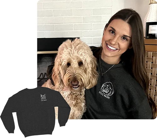 A DOG MOM SITTING WITH HER DOG WEARING HER EMBROIDERED GREY SWEATSHIRT