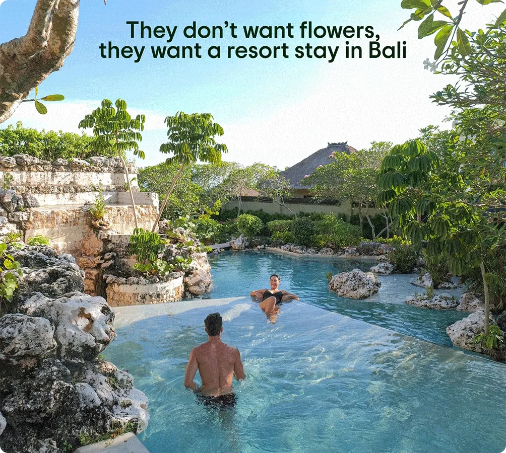 Image Description: A couple floats in a swimming pool in a tropical location with “They don’t want flowers, they want a resort stay in Bali” text overlay, a woman poses for a photograph on a cliff overlooking the blue ocean with “They don’t want flowers, they want to hike in Mauritius” text overlay, and a woman looks at the glass of an underwater restaurant with “They don’t want flowers, they want an underwater dinner in the Maldives” text overlay.