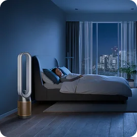 A person sleeps next to their Dyson Find+Follow Purifier Cool fan.