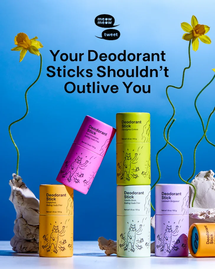 Colorful deodorant sticks on a blue background with daffodils