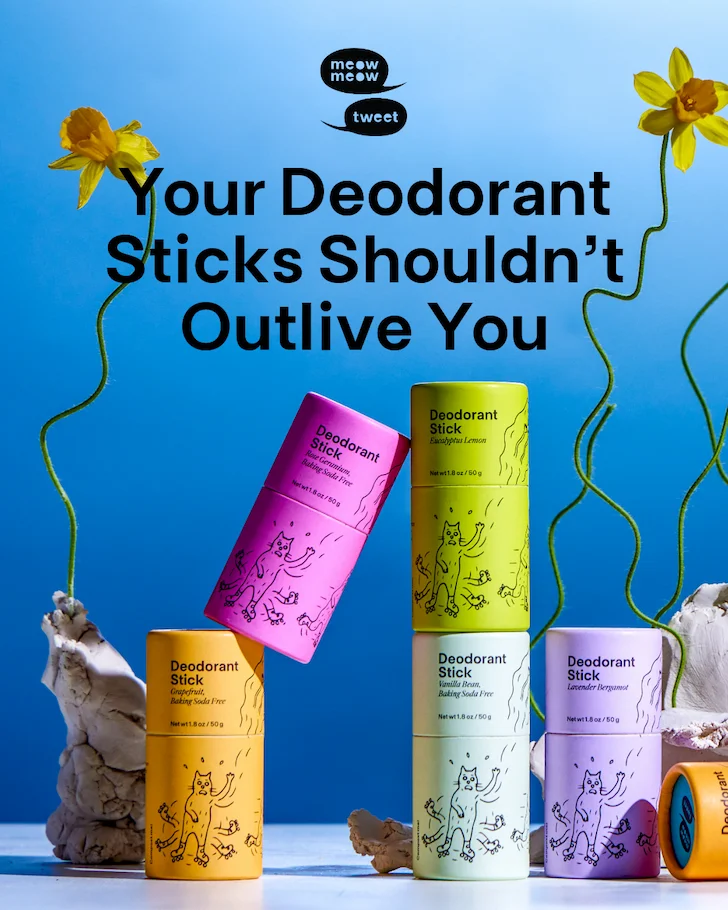 Colorful deodorant sticks on a blue background with daffodils