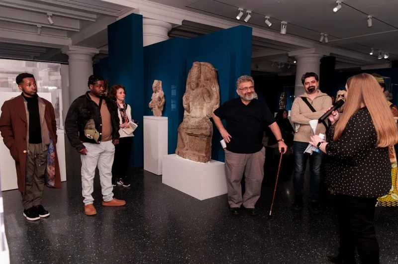A group of people in an art gallery