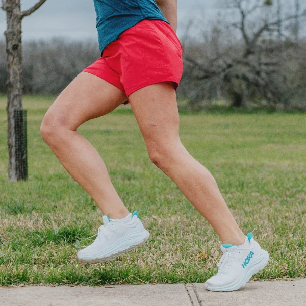 Woman wearing HOKA Clifton 10 shoes