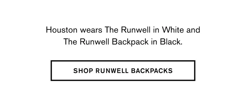 Houston wears The Runwell in White and The Runwell Backpack in Black. | SHOP RUNWELL BACKPACKS