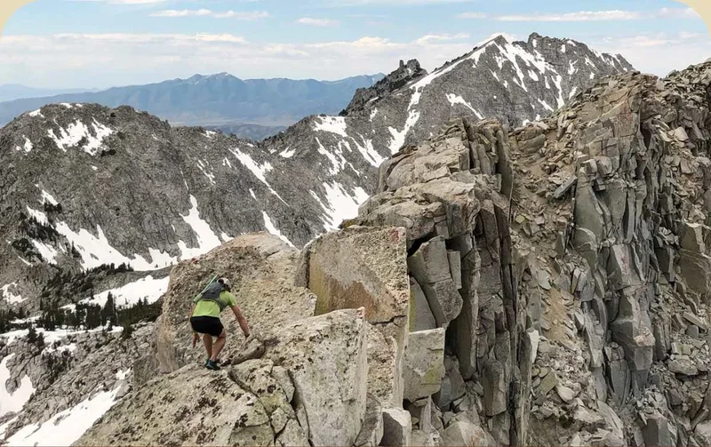 Patagonia Stories. A hiker navigates a steep and rocky ridge in the Wasatch Mountains.