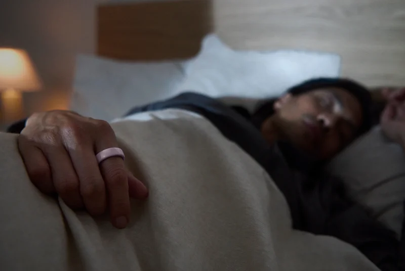 Person sleeping wearing Oura Ring