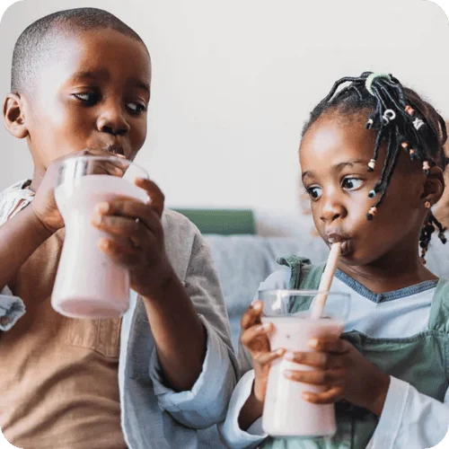 siblings drinking smoothies for kids that combat health issues