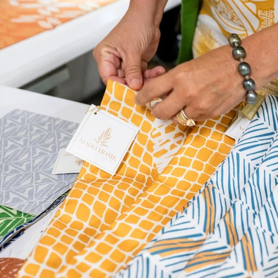 a picture of two hands holding fabric