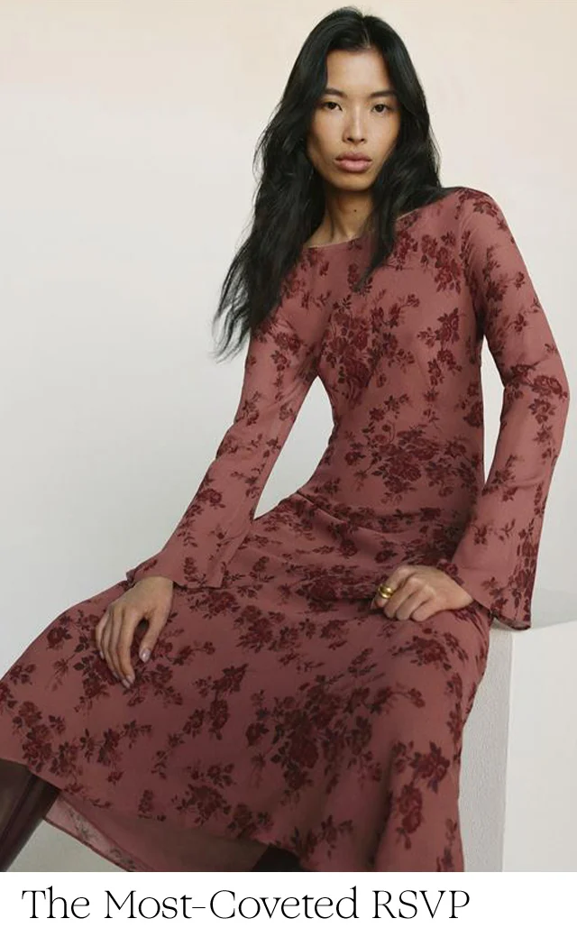 A woman wearing a red floral-print dress.