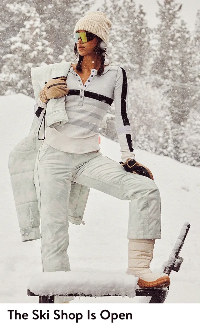 Women wearing stylish ski gear.