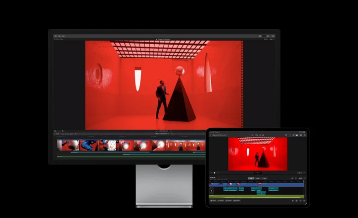 Mac Studio Display, iPad Pro 13, Final Cut Pro timeline, still of a man in a blue suit placing a silver ball on top of a black triangular structure in a red room with abstract-shaped windows