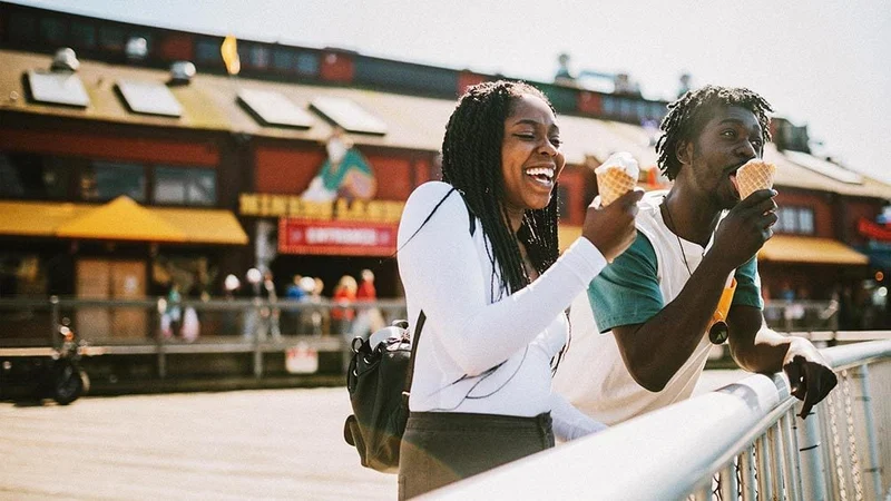 Image description: A couple enjoying ice cream on a pier in Seattle, Washington