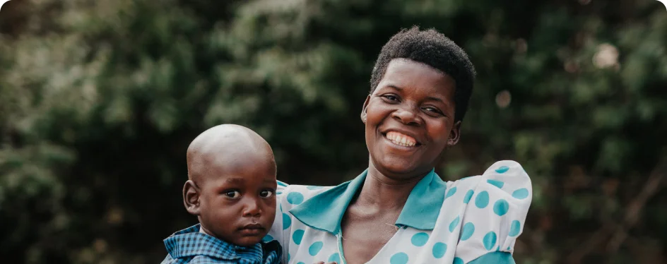 Photo of a woman holding her son in Tanzania