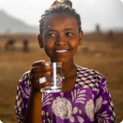 Image of Ethiopian girl holding a glass of clean water
