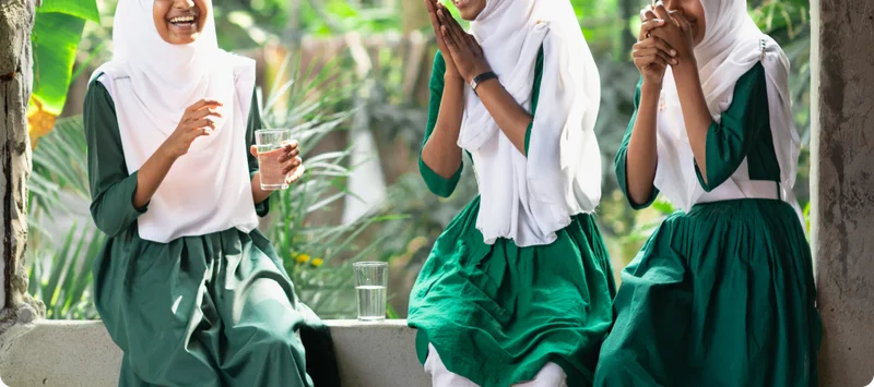 Photo of 3 best friends laughing together in Bangladesh