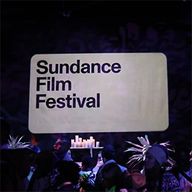 A sasquatch hangs out with audience members at the 'Sasquatch Sunset' screening. Photographer: Chloe Collyer