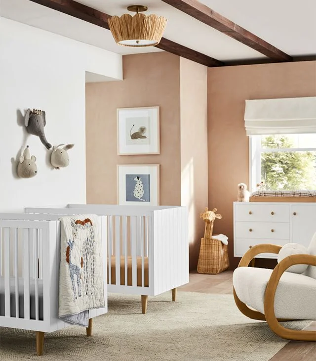 sharing a space with two cribs