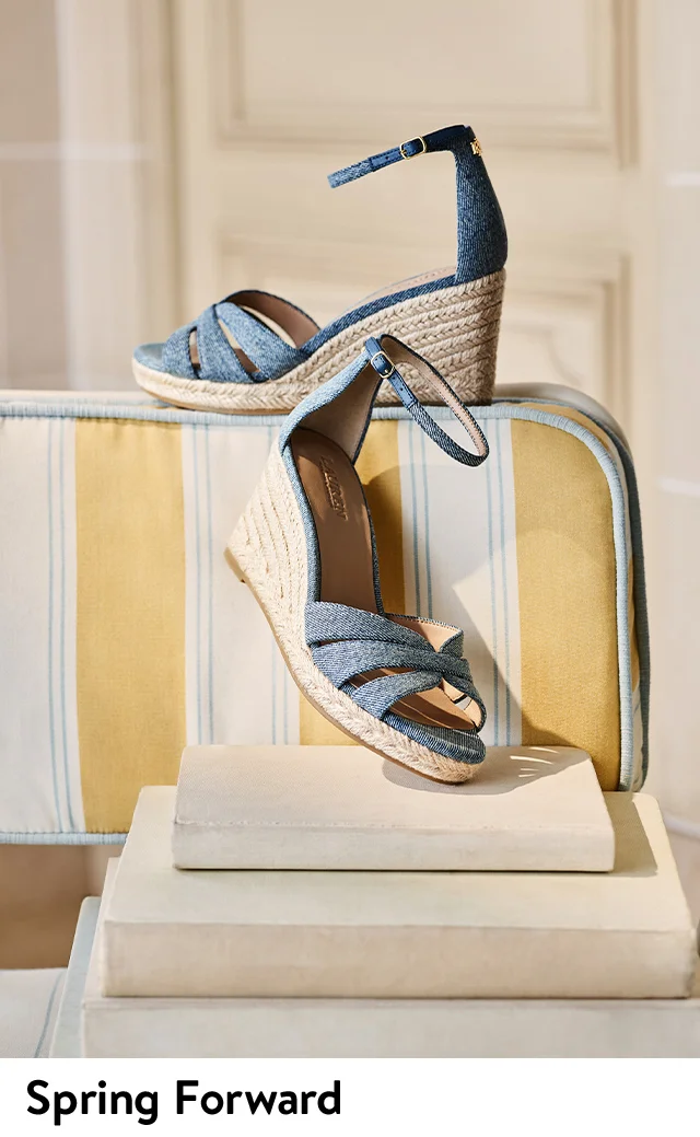 Blue ankle-strap sandals with woven raffia wedges.