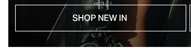 Dark, buckled leather-look clothing detail next to a bare arm. The overlay text says 'SHOP NEW IN' to discover our latest fashion arrivals.