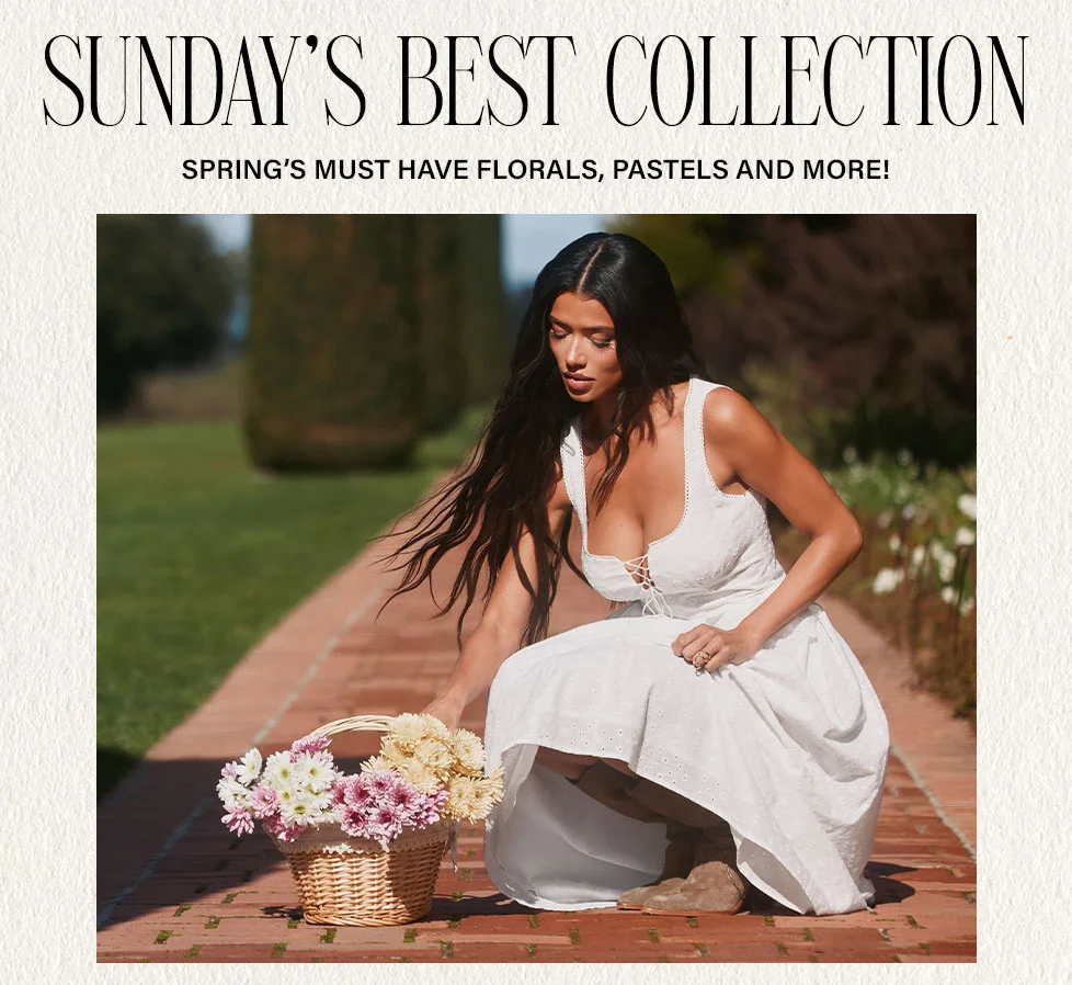 White lace-up midi dress, woman crouches with a wicker basket of pastel spring florals on a brick path, promoting Sunday's Best Collection.