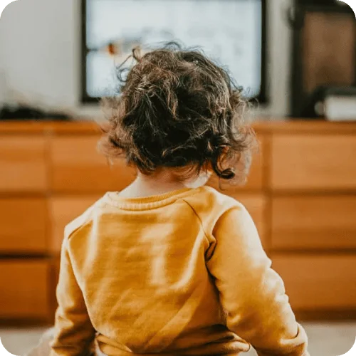 a toddler watching one of the tv shows approved by an SLP a toddler watching one of the tv shows approved by an SLP